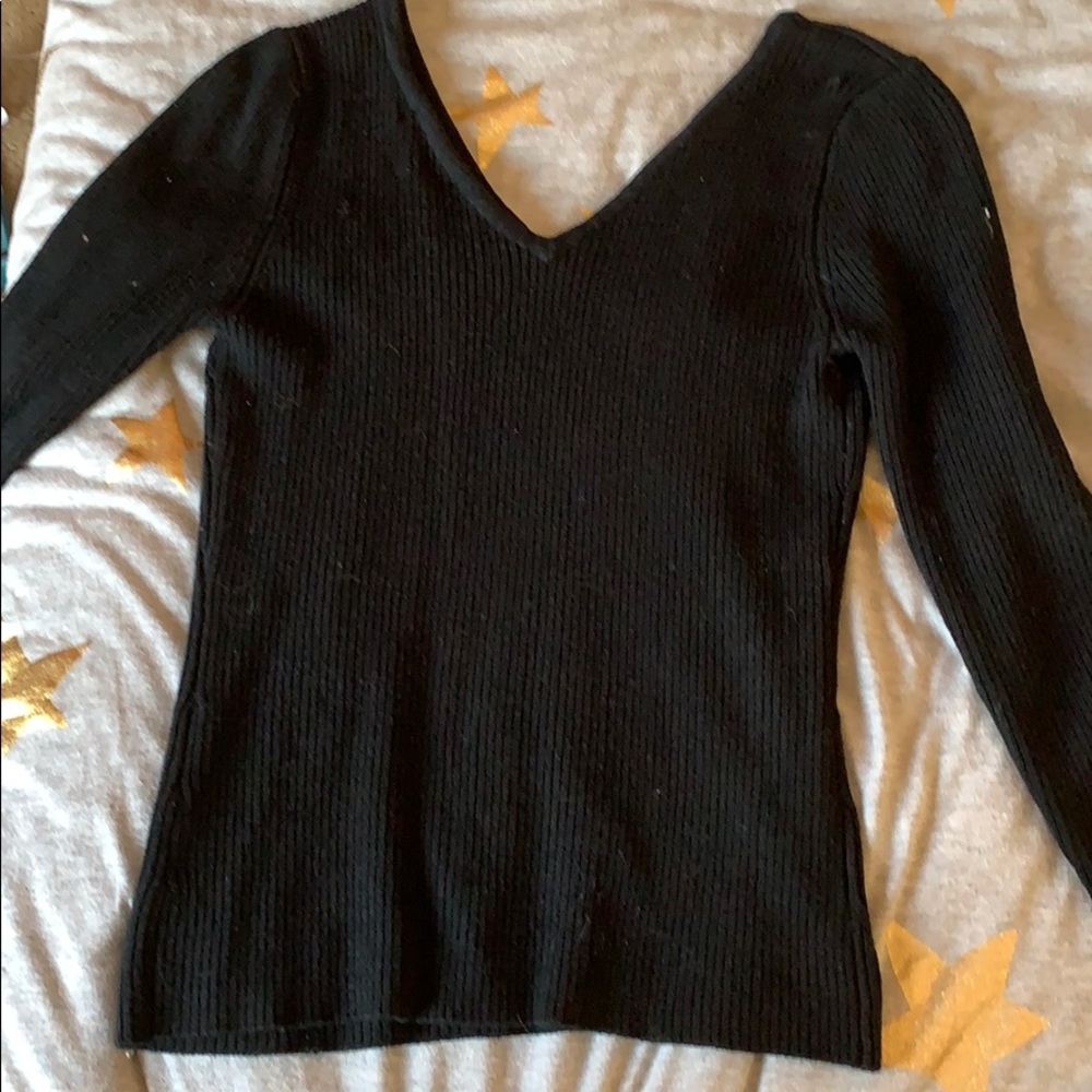 A small knit V-neck sweater/shirt. In black